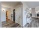 Hallway featuring modern floors, neutral walls and decor, and lots of doorways at 20139 N Bustos Way, Maricopa, AZ 85138