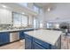 Spacious kitchen island featuring white countertops, modern backsplash, and stainless steel appliances at 20139 N Bustos Way, Maricopa, AZ 85138
