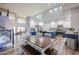 Bright kitchen with white cabinetry, blue island, stainless steel appliances, and a dining table with bench seating at 20139 N Bustos Way, Maricopa, AZ 85138