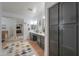 A bathroom with dual vanities, ample cabinet space, and a large mirrored closet at 20139 N Bustos Way, Maricopa, AZ 85138