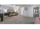 This luxurious main bedroom has plush carpets, a stylish bed frame, and lots of natural light at 20139 N Bustos Way, Maricopa, AZ 85138