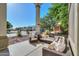 This covered patio offers a cozy seating area, perfect for enjoying the outdoors and relaxing at 20139 N Bustos Way, Maricopa, AZ 85138