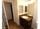 Bathroom features granite counters, dark wood cabinets, and a framed mirror at 2025 E Campbell Ave # 120, Phoenix, AZ 85016