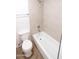 Bathroom features a toilet and a tub shower with tiled walls at 2025 E Campbell Ave # 120, Phoenix, AZ 85016