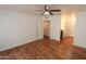 A spacious bedroom has laminate floors, ceiling fan, and leads into a bathroom at 2025 E Campbell Ave # 120, Phoenix, AZ 85016