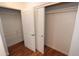 A walk in closet features an open closet door, shelving, and hanging racks at 2025 E Campbell Ave # 120, Phoenix, AZ 85016