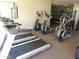 A community gym featuring several treadmills and elliptical machines for resident fitness and well-being at 2025 E Campbell Ave # 120, Phoenix, AZ 85016
