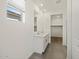 This is a bathroom with a double vanity and easy access to the closet and shower at 20795 N Roadrunner Ln, Maricopa, AZ 85138