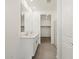 This is a bathroom with a double vanity and easy access to the closet and shower at 20795 N Roadrunner Ln, Maricopa, AZ 85138