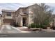 Beautiful two-story home with a two-car garage, well-maintained yard, and mature trees at 21050 E Munoz St, Queen Creek, AZ 85142