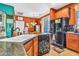 The kitchen features modern appliances, and tile floors at 21050 E Munoz St, Queen Creek, AZ 85142