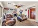 Spacious living room area with comfortable seating and a decorative rug at 21050 E Munoz St, Queen Creek, AZ 85142