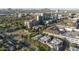 Wide aerial view of buildings and homes surrounded by mature trees and blue skies at 235 W Portland St, Phoenix, AZ 85003