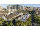 Bird's eye view of a neighborhood with multi-story buildings and lush green trees at 235 W Portland St, Phoenix, AZ 85003