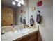 Well-lit bathroom featuring granite countertop, modern fixtures, and towel racks at 235 W Portland St, Phoenix, AZ 85003