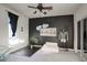Stylish bedroom with a dark accent wall, modern decor, and a sliding glass door closet at 235 W Portland St, Phoenix, AZ 85003