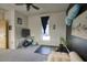 Bedroom featuring modern decor, a ceiling fan, and a window with natural light at 235 W Portland St, Phoenix, AZ 85003