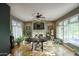 Bright dining room with hardwood floors, fireplace, modern decor and large windows at 235 W Portland St, Phoenix, AZ 85003