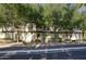 Inviting townhome featuring mature landscaping and a charming facade at 235 W Portland St, Phoenix, AZ 85003