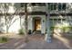 Welcoming front entrance with stone walkway, wood door and mature trees at 235 W Portland St, Phoenix, AZ 85003