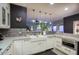 Stylish kitchen with white cabinetry, open layout, and stainless steel sink at 235 W Portland St, Phoenix, AZ 85003