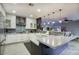 Modern kitchen featuring white cabinets, stainless steel appliances, and tile backsplash at 235 W Portland St, Phoenix, AZ 85003