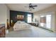 Spacious main bedroom with decorative accent wall, fan, and sliding doors at 235 W Portland St, Phoenix, AZ 85003
