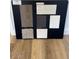 A presentation board shows flooring, cabinet, and tile options for a new construction home at 24237 W Southgate Ave, Buckeye, AZ 85326
