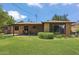 Large lush backyard with covered patio and shade trees at 2913 E Earll Dr, Phoenix, AZ 85016