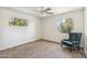 Bedroom showcases gray carpet, ceiling fan, natural light, and comfy chair at 2913 E Earll Dr, Phoenix, AZ 85016