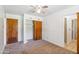 Bedroom featuring a closet with sliding doors and an ensuite bathroom at 2913 E Earll Dr, Phoenix, AZ 85016