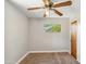 Neutral bedroom with a window offering natural light and a standard closet at 2913 E Earll Dr, Phoenix, AZ 85016