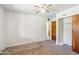 Bedroom featuring a built-in closet with sliding doors and an ensuite bathroom at 2913 E Earll Dr, Phoenix, AZ 85016