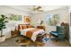 Cozy bedroom with stylish decor, including area rug and comfortable chair at 2913 E Earll Dr, Phoenix, AZ 85016