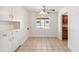 Cozy dining area featuring white storage cabinets, tiled flooring and lots of sunlight at 2913 E Earll Dr, Phoenix, AZ 85016