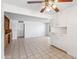 Dining room with white cabinets, tiled floor, ceiling fan, and lots of natural light at 2913 E Earll Dr, Phoenix, AZ 85016