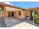 Inviting front entrance with a covered porch, brick facade, and a well-manicured garden at 2913 E Earll Dr, Phoenix, AZ 85016