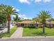 Charming single-story home with a well-maintained lawn, palm trees, and a concrete driveway at 2913 E Earll Dr, Phoenix, AZ 85016