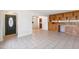 Open-concept living space featuring tiled floors, custom shelving, and lots of natural light at 2913 E Earll Dr, Phoenix, AZ 85016