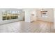Bright and airy living area with large window, tiled floor, and built-in storage at 2913 E Earll Dr, Phoenix, AZ 85016