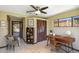 Office space features closet, tile floors, fan, desk, and chair at 2913 E Earll Dr, Phoenix, AZ 85016