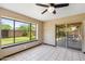Bright sun room with large window offering views of the landscaped backyard at 2913 E Earll Dr, Phoenix, AZ 85016