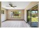 Sunroom features tile floors, natural light, backyard views, and sliding glass doors at 2913 E Earll Dr, Phoenix, AZ 85016