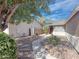 Backyard landscaping, a gravel bed, and a cement pathway for outdoor enjoyment at 30517 N Maple Chase Dr, San Tan Valley, AZ 85143