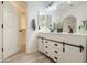 Elegant bathroom features double vanity sinks, modern lighting, and contemporary finishes at 30517 N Maple Chase Dr, San Tan Valley, AZ 85143