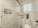Stylish bathroom with a glass-enclosed shower featuring white subway tiles and black trim at 30517 N Maple Chase Dr, San Tan Valley, AZ 85143