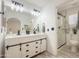 Modern bathroom featuring double sinks, a walk-in shower, and sleek black fixtures at 30517 N Maple Chase Dr, San Tan Valley, AZ 85143