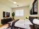 Well-appointed bedroom features a bed, TV, and stylish furnishings at 30517 N Maple Chase Dr, San Tan Valley, AZ 85143