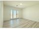 Spacious bedroom with modern flooring and ample natural light from the glass paneled patio door at 30517 N Maple Chase Dr, San Tan Valley, AZ 85143