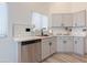 Bright kitchen with a stainless steel dishwasher, white countertops, and shaker-style cabinets at 30517 N Maple Chase Dr, San Tan Valley, AZ 85143
